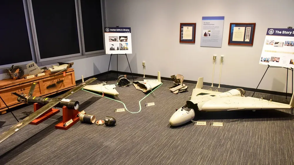 Recovered Shahed-type one-way attack drones laid out on the floor of a U.S. display room